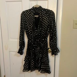 Black and gold mini dress with ruffles.